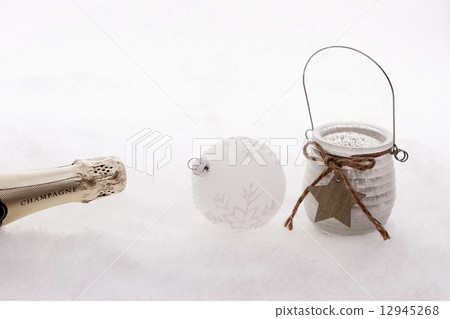 Christmas ball, wind candle, champagne bottle in snow Christmas ball, wind candle, champagne bottle in snow 12945268