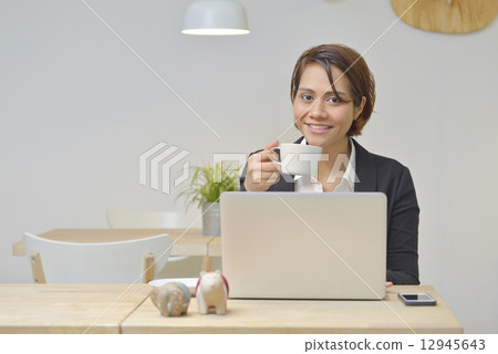 Asian Businesswoma at Cafe using Laptop , Having coffee , Cafe Asian Businesswoma at Cafe using Laptop , Having coffee , Cafe 12945643