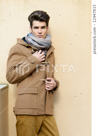 Attractive young handsome man, model of fashion in urban backgro Attractive young handsome man, model of fashion in urban backgro 12947615
