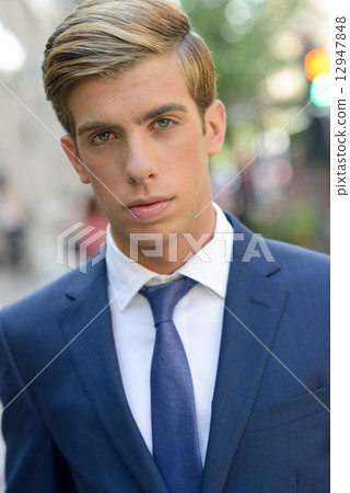 Attractive young businessman in urban background Attractive young businessman in urban background 12947848