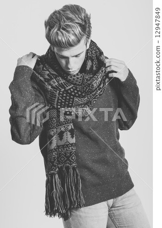 Handsome blonde man wearing sweater and scarf Handsome blonde man wearing sweater and scarf 12947849