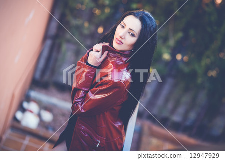 Beautiful woman with long hair in urban background 12947929