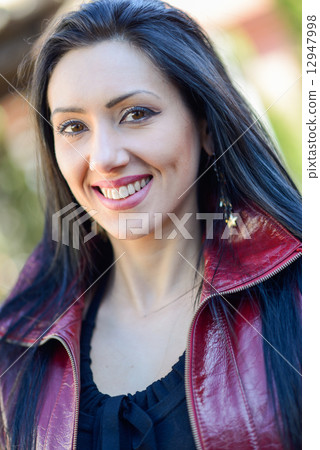 Beautiful woman with long hair in urban background Beautiful woman with long hair in urban background 12947998