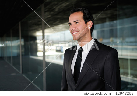 Portrait of a handsome young business man smiling 12948295