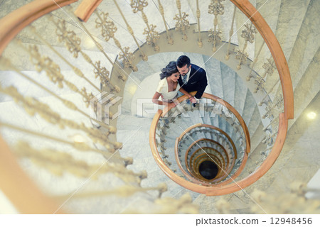 Just married couple in a spiral staircase 12948456