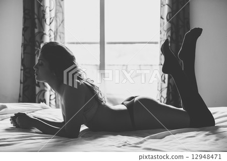 Sexy young woman in lingerie posing on the bed Sexy young woman in lingerie posing on the bed 12948471