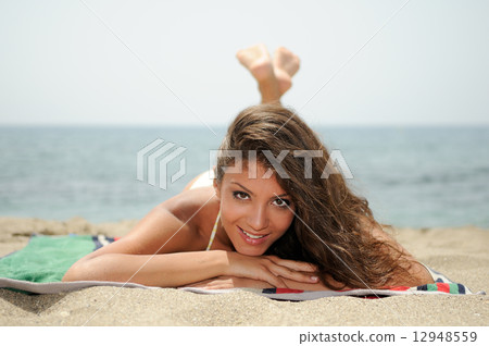 Woman with beautiful body on a tropical beach Woman with beautiful body on a tropical beach 12948559