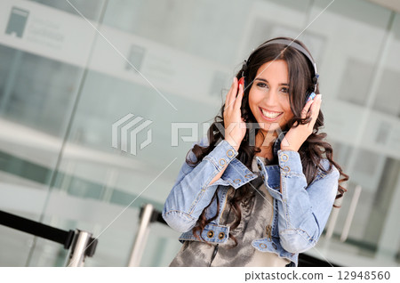 Young girl with headphones 12948560