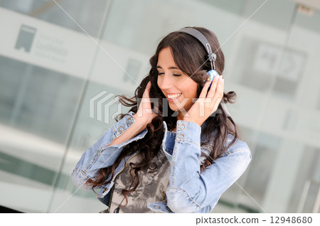 Young girl with headphones 12948680