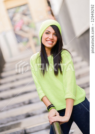 Young woman with green eyes in urban background 12949292