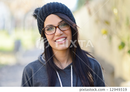 Young woman with green eyes in urban background Young woman with green eyes in urban background 12949319