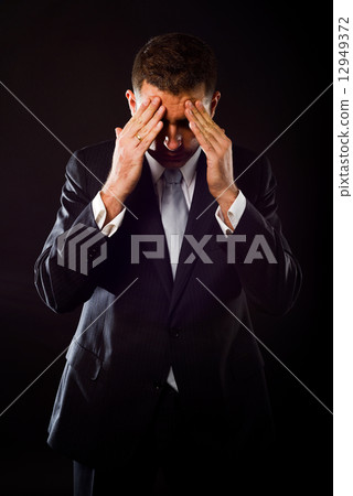 Businessman concerned about crisis Businessman concerned about crisis 12949372