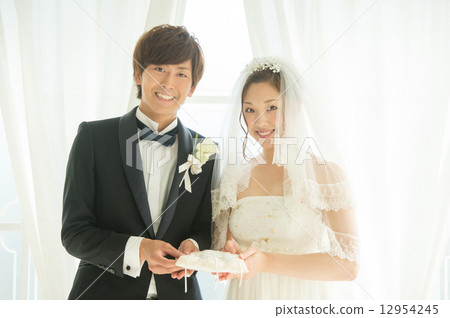 Bride and groom with ring pillow Bride and groom with ring pillow 12954245