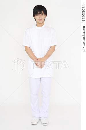 A young man wearing a white suit A young man wearing a white suit 12955084