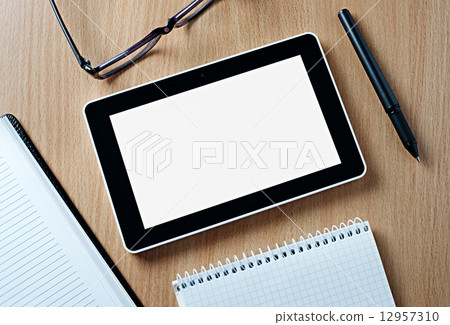 Tablet Computer on Wooden Table with Copy Space Tablet Computer on Wooden Table with Copy Space 12957310