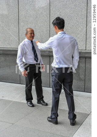 Two Asian men in office in argument / dispute Two Asian men in office in argument / dispute 12959446