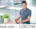 Man with Computer 12961788