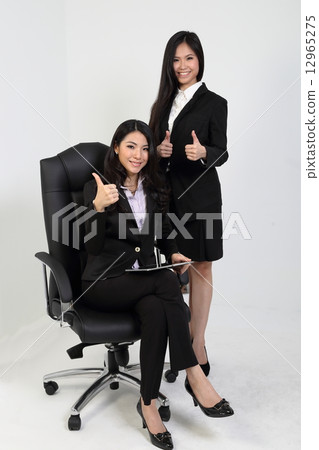 Woman standing lady sitting thumbs up 12965275