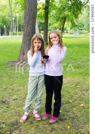 Cute two eating girls Cute two eating girls 12966083