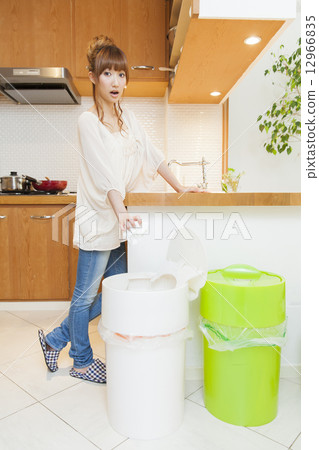 Young lady washing dishes 12966835