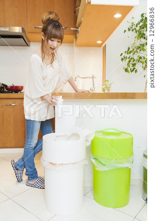 Young lady washing dishes Young lady washing dishes 12966836