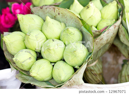 Green lotus bunch wrap by lotus leaves in market. 12967071