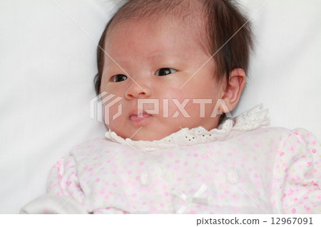 One month old baby's smile 12967091