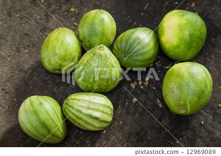 Organic oriental melons at outdoor asian market. Organic oriental melons at outdoor asian market. 12969089