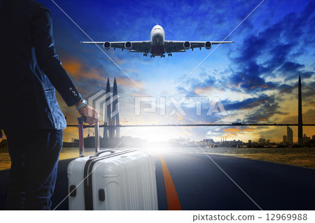 young business man standing with luggage on urban airport runway 12969988
