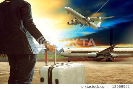 jet plane flying over runways and beautiful dusky sky with copy 12969991