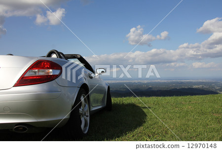 Open car looking at blue sky, white clouds and Toyama plain (right) Open car looking at blue sky, white clouds and Toyama plain (right) 12970148