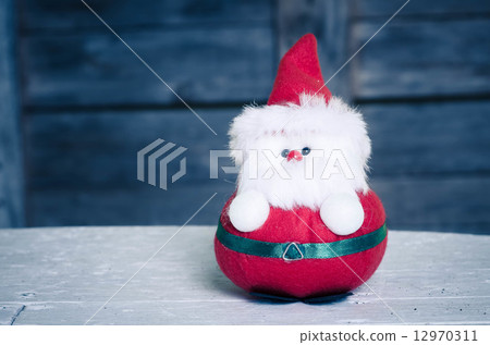 Santa doll with wooden background and filter effect. Santa doll with wooden background and filter effect. 12970311