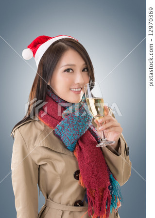 Smiling Asian woman hold a glass of champagne Smiling Asian woman hold a glass of champagne 12970369