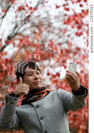 1 man (Autumn leaves autumn dead tree dead tree dead leaves dead leaves casual coat muffler) 1 man (Autumn leaves autumn dead tree dead tree dead leaves dead leaves casual coat muffler) 12970582
