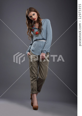 Studio Shot of Trendy Fashion Model in Pants and Blouse Studio Shot of Trendy Fashion Model in Pants and Blouse 12973355