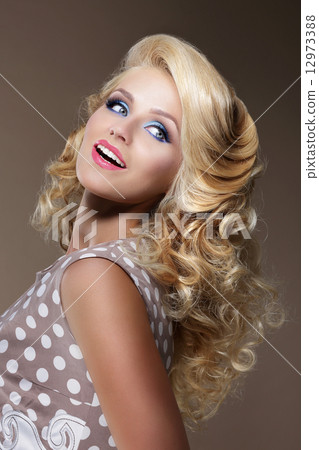 Happy Woman with Frizzy Blond Hairs Looking Up Happy Woman with Frizzy Blond Hairs Looking Up 12973388