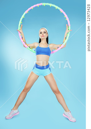 Sport. Active Shapely Sportswoman with Hoop 12973428