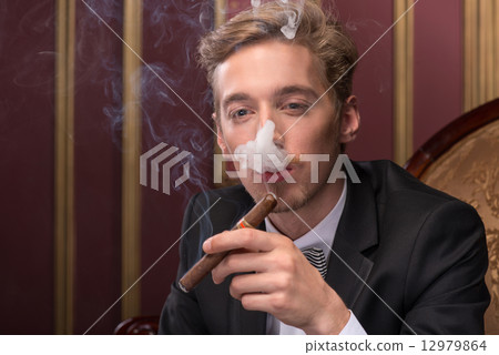 Handsome man with cigar Handsome man with cigar 12979864