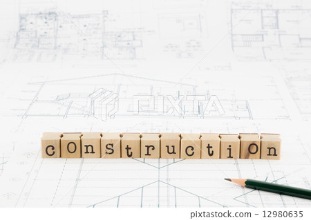 construction word blocks stack on blueprints and floor plan construction word blocks stack on blueprints and floor plan 12980635