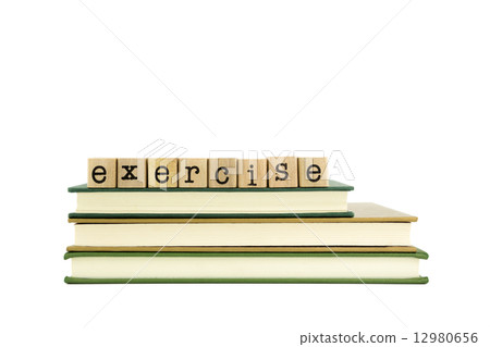 exercise word on wood stamps and books 12980656
