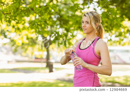 Fit blonde opening her water bottle Fit blonde opening her water bottle 12984669