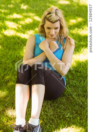 Fit blonde doing sit ups in the park 12984957