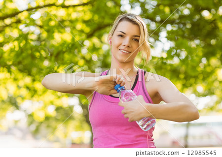 Fit blonde opening her water bottle 12985545