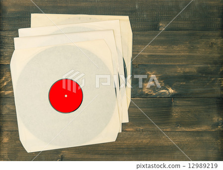 vintage vinyl records on rustic wooden background vintage vinyl records on rustic wooden background 12989219