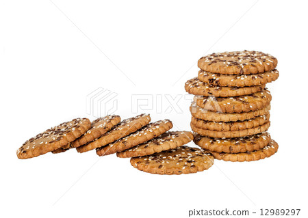 Stackand pile of round cookies with sesame and flax seeds 12989297