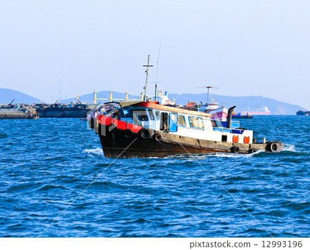 Wooden fishing boat on sea Wooden fishing boat on sea 12993196