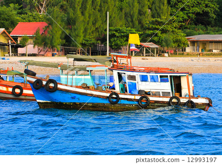 Wooden fishing boat on sea Wooden fishing boat on sea 12993197