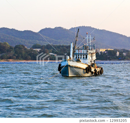 Wooden fishing boat on sea Wooden fishing boat on sea 12993205