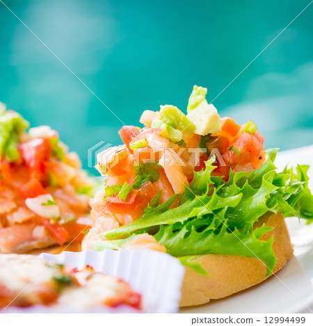 Bruschetta topped with tomato Bruschetta topped with tomato 12994499