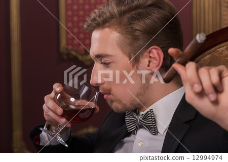 Handsome man with cigar 12994974